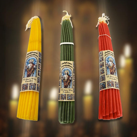 Colorful beeswax taper candles for church and spiritual rituals