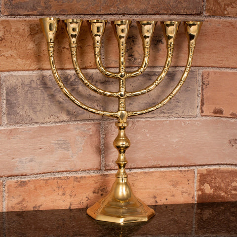 Brass menorah with biblical symbolism for prayer, devotion, and Jewish holiday celebrations