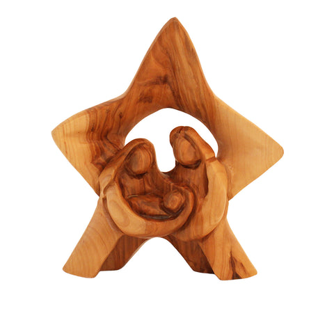 Wooden nativity scene inside a star-shaped olive wood carving on a white background