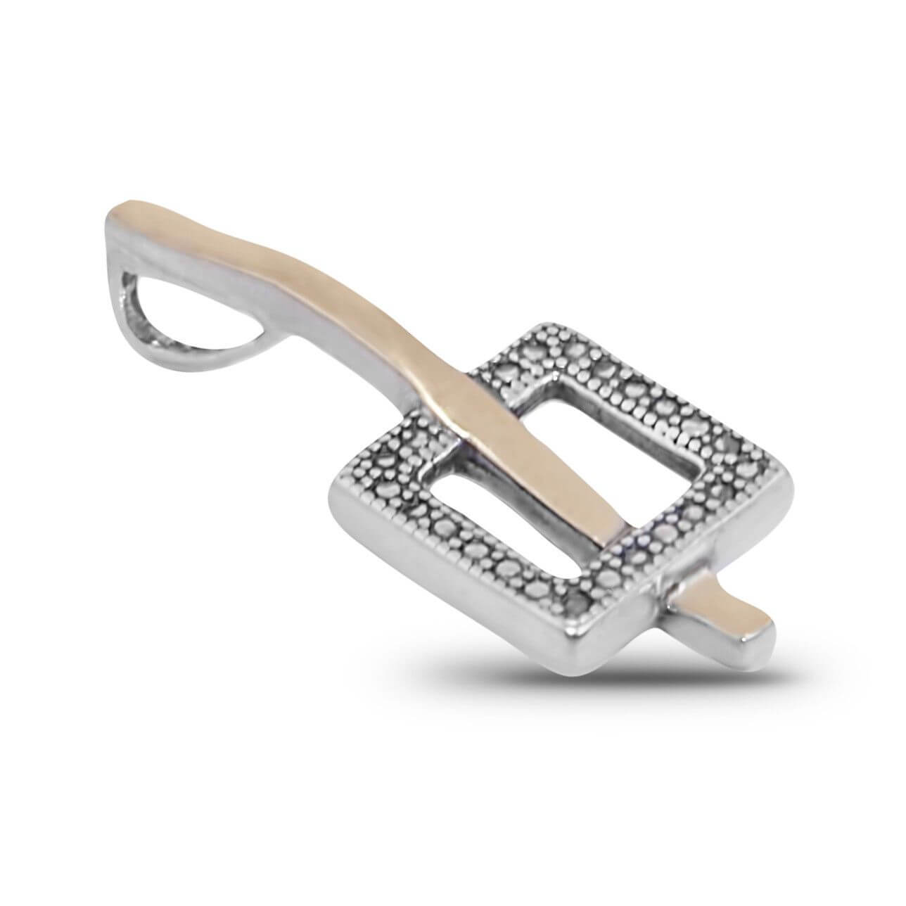 Closeup chain and bail detail on women’s silver pendant necklace
