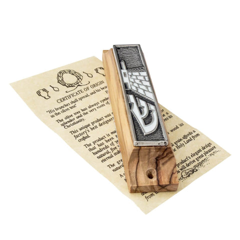 Full mezuzah on doorpost with olive wood and enamel highlights
