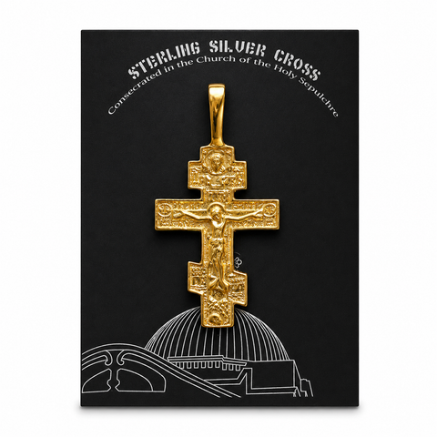 Gold Orthodox Cross Pendant displayed on a Sterling Silver Cross certificate card, consecrated in the Church of the Holy Sepulchre in Jerusalem, with detailed crucifix design and Holy Land devotional jewelry presentation