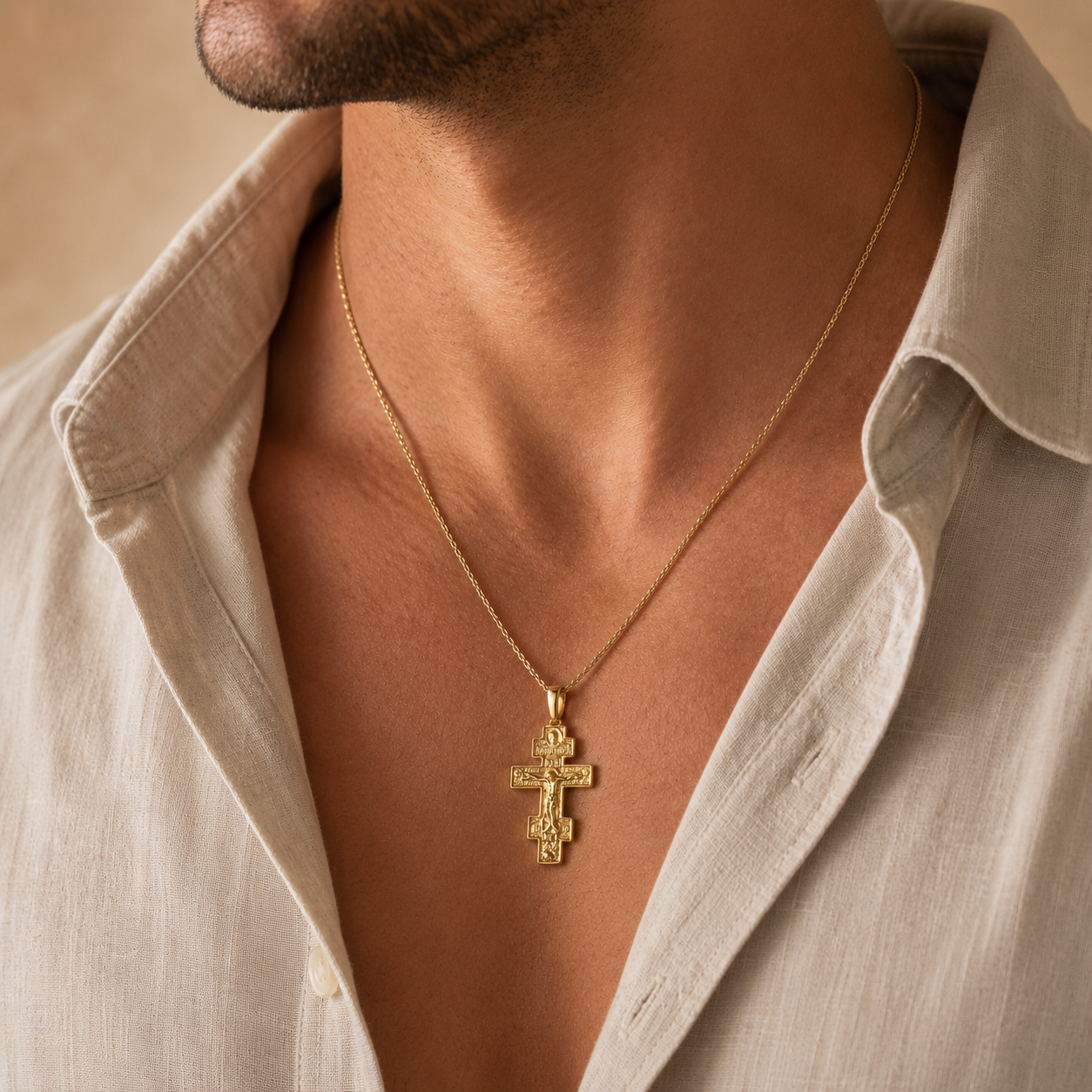 Gold Orthodox Cross Pendant worn on a man’s neck, featuring detailed crucifix design, 925 sterling silver base with 18K gold plating, and elegant Holy Land devotional jewelry style