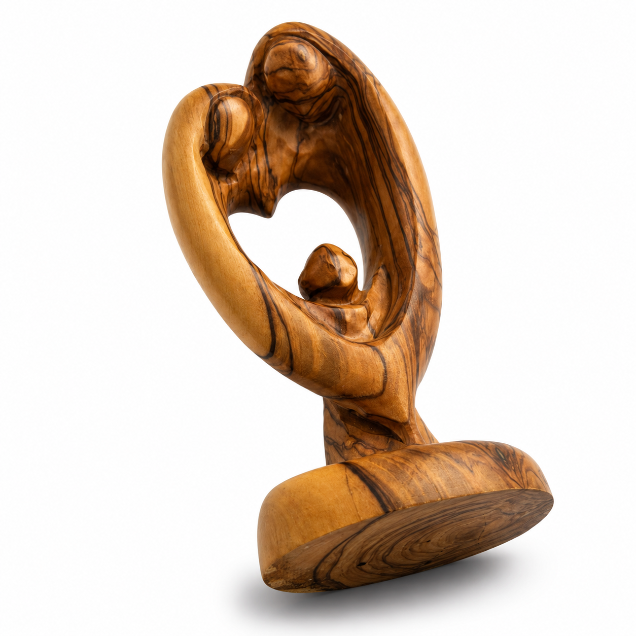 Dynamic side view of an abstract olive wood Holy Family figurine, highlighting the natural wood grain and heart silhouette