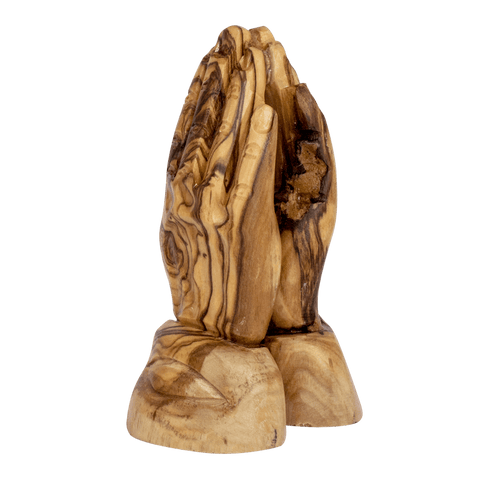 Base detail of handmade olive wood praying hands sculpture from Bethlehem