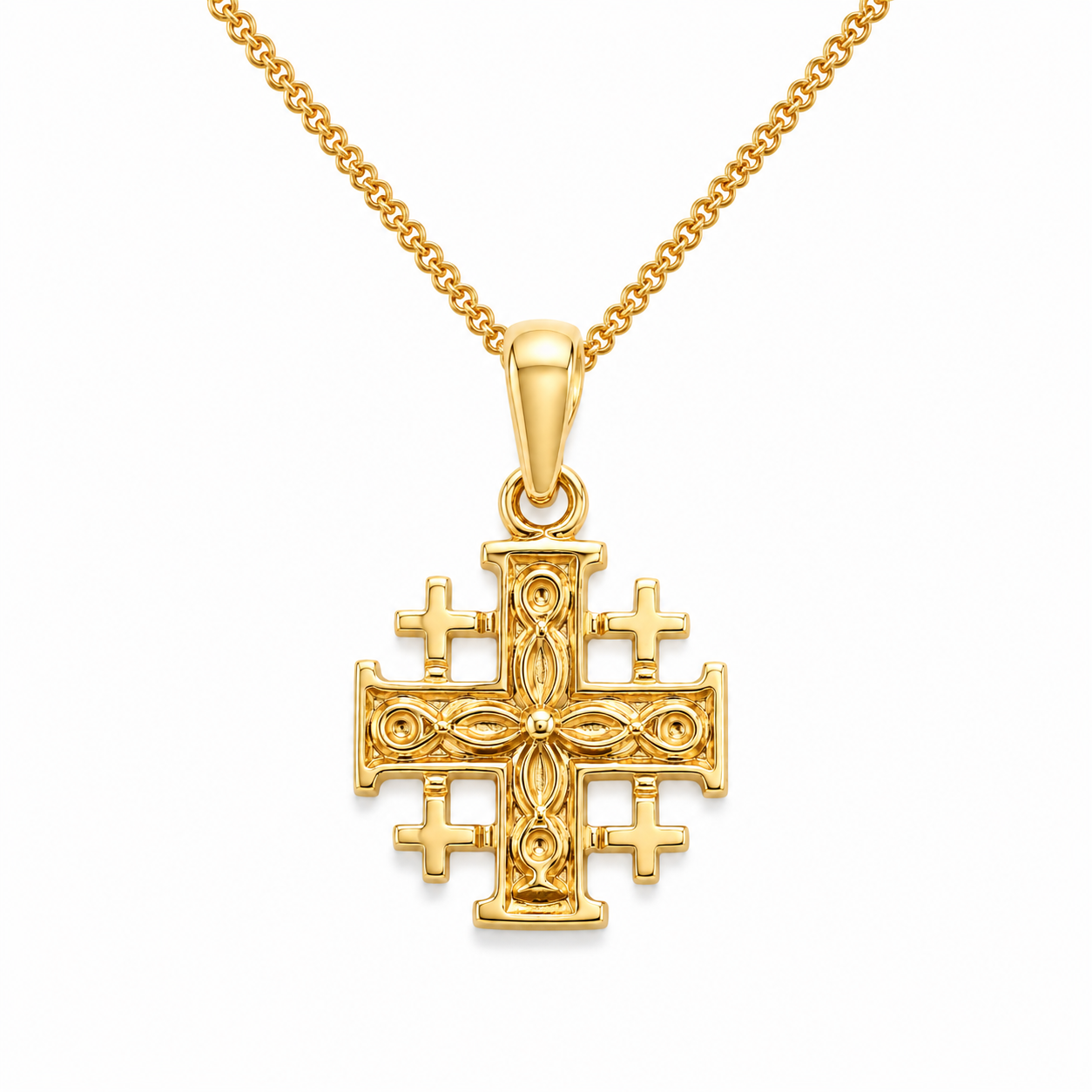 Gold cross pendant on a chain against a white background