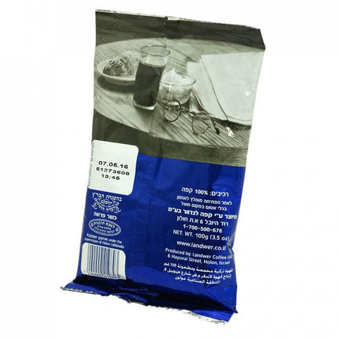 Angled pack of kosher Israeli black coffee 100g with aromatic design
