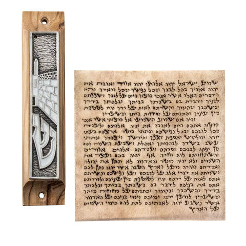 Angled mezuzah showing Shin letter and olive wood grain
