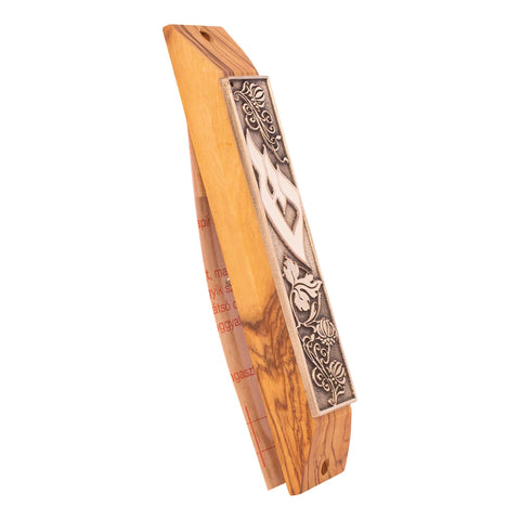 Angled olive wood mezuzah case showing enameled Shin design
