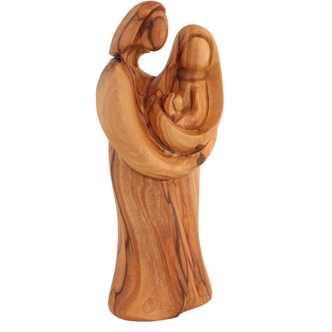 Olive wood Holy Family nativity decor on white background
