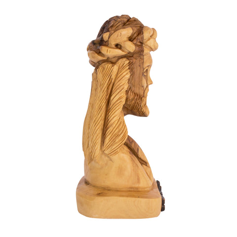 detail of facial carving jesus head bust in olive wood handmade
