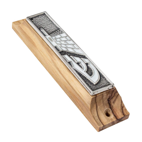 Western Wall engraving close-up on olive wood mezuzah
