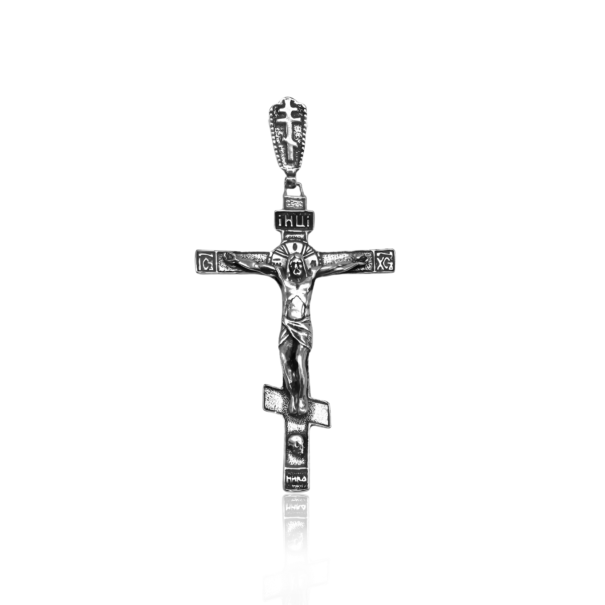 Engraving detail on sterling silver Orthodox crucifix pendant
