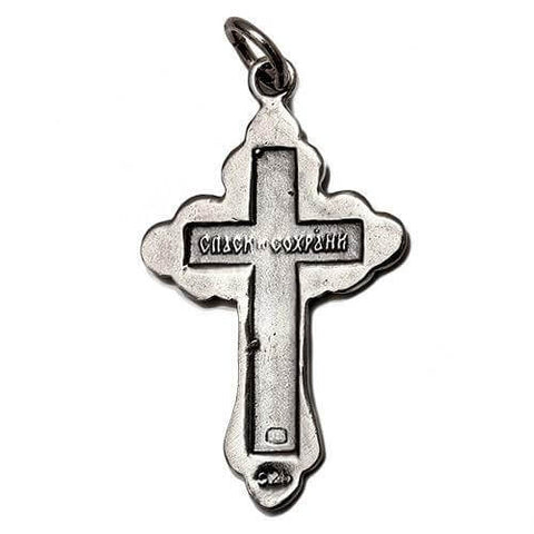 Reverse side of Orthodox silver cross pendant with detailed engraving

