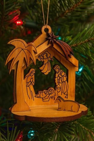 olive wood manger scene ornament with Holy Family carving