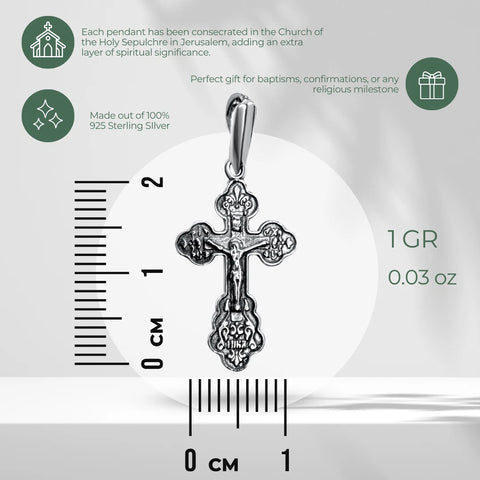 Silver crucifix pendant specification image with ruler showing 2 cm height, 1 cm width, 1 g weight, 925 sterling silver text, and green icons on gray background