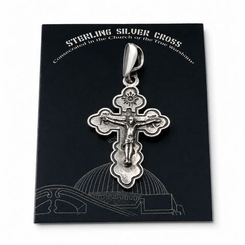 A 925 sterling silver Orthodox crucifix pendant displayed on its black certificate of authenticity card with silver foil lettering. This authentic presentation makes it ready as a traditional Holy Land Christian gift.