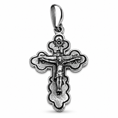 A detailed sterling silver Orthodox cross pendant with a crucifix relief of Jesus, traditional patterned trefoil ends, and a polished bail, set against a plain white background. Order this authentic Holy Land Christian gift online.