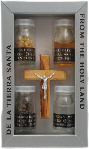 full small Christian gift set with crucifix and holy elements arranged
