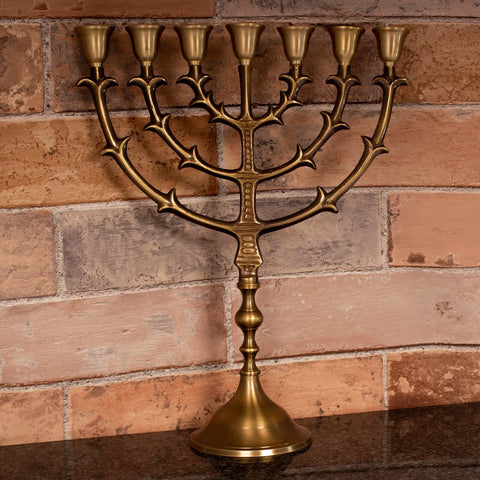 Spiritual menorah candle holder with biblical symbolism and ceremonial design