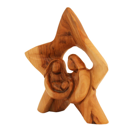 Wooden star-shaped sculpture with a central figure on a white background