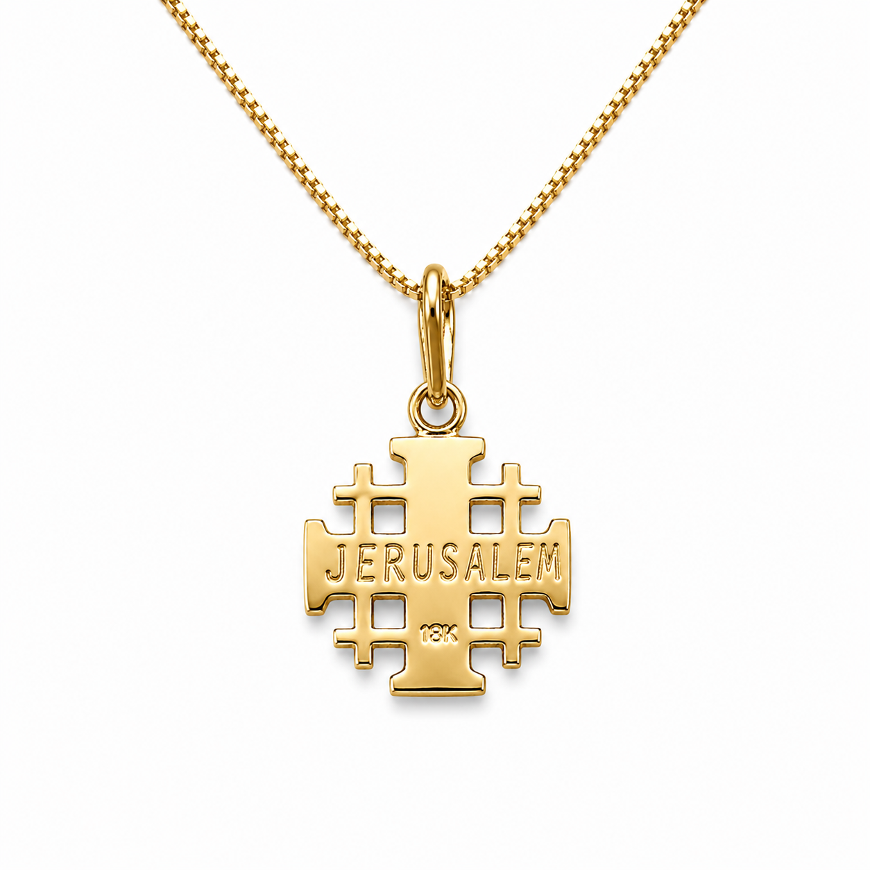 Gold Jerusalem cross pendant on a chain against a white background