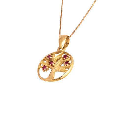 angled front 14k gold amulet tree of life with garnet gemstone
