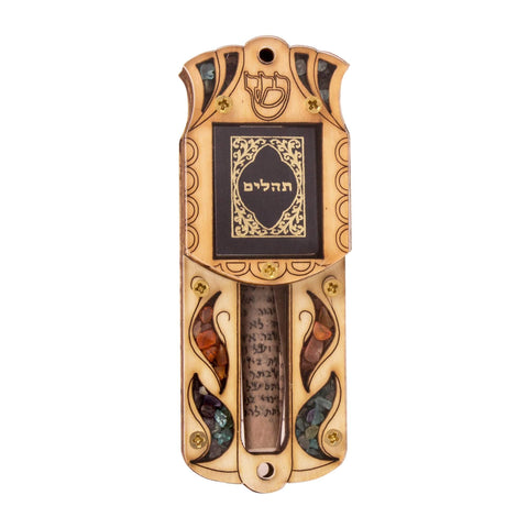 Handcrafted wooden car mezuzah with intricate stone details on the front.


